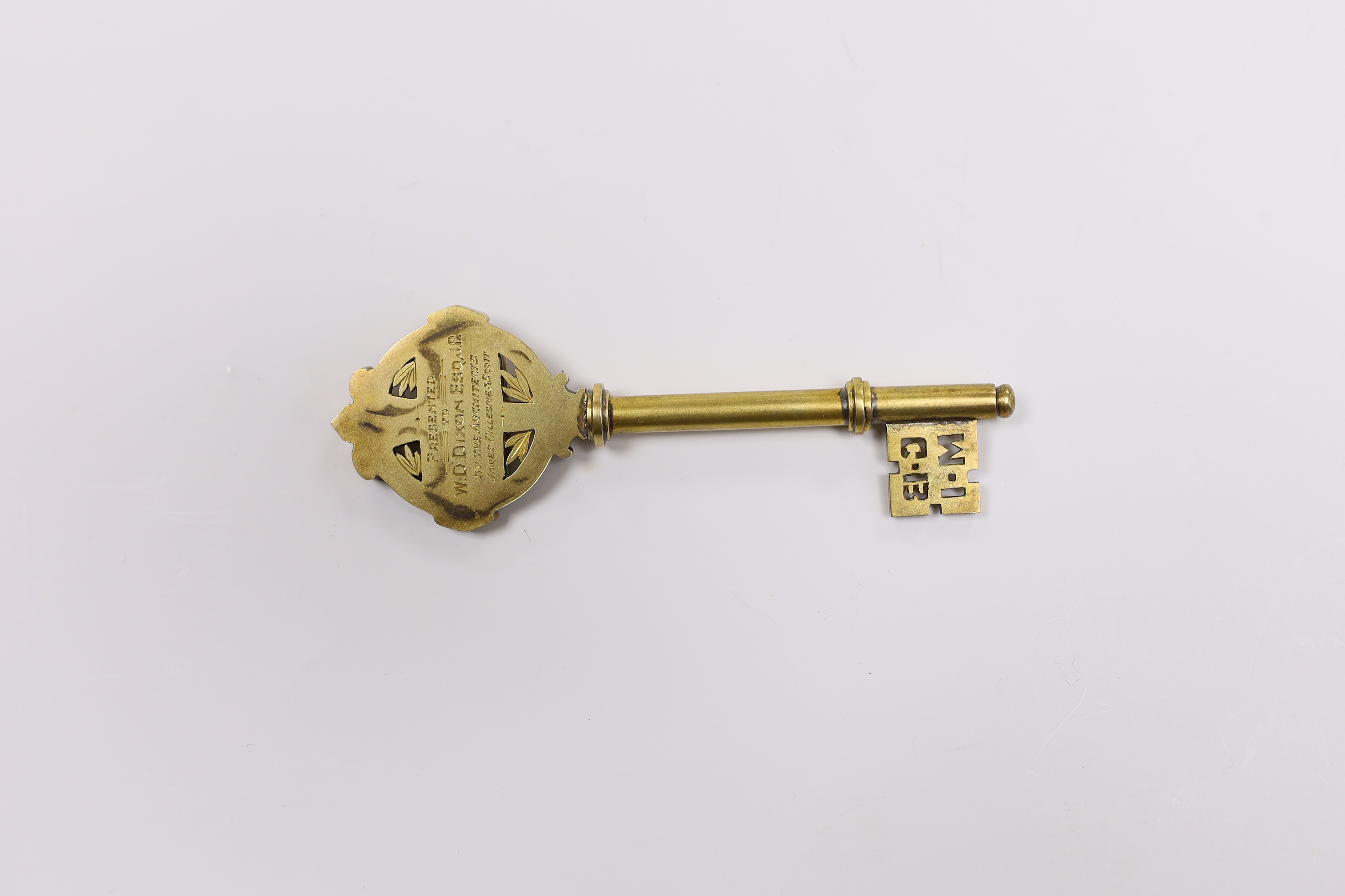 A cased gilt presentation key for the Guard Bridge Memorial Institute 1914 to 1919, presented by the architects, James Gillespie and Scott to W.D. Dixon, in fitted case, key 10.5cm